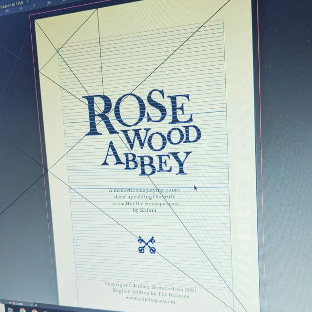 Photograph of a screen showing the title page of Rosewood Abbey opened in Indesign with various construction baselines. 