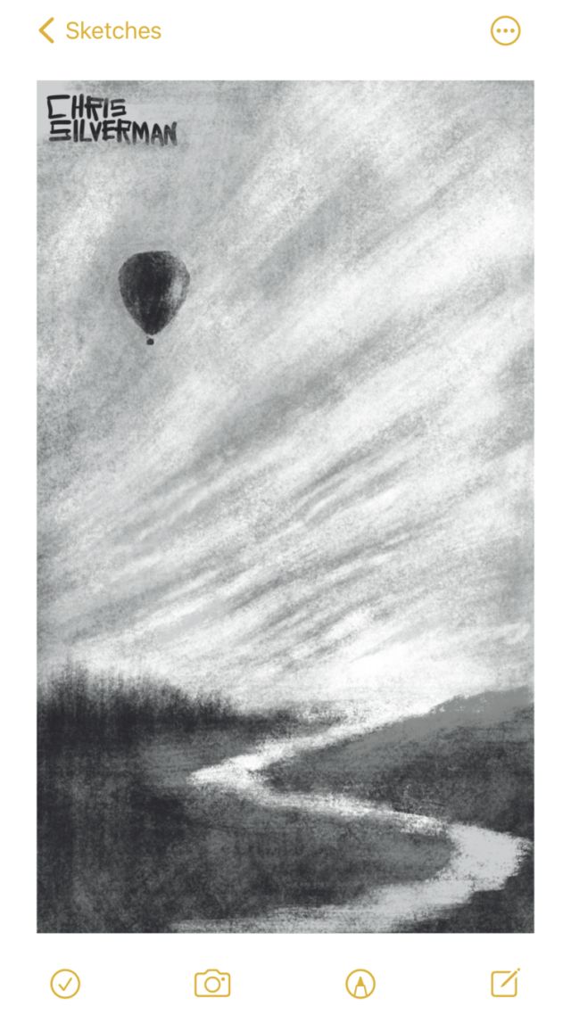 A river winds through a flat meadow with trees on the horizon. Above is a vast, open sky, covered with banded clouds. In the top left of the sky is a black hot-air balloon.