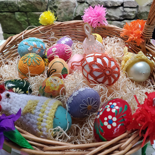 picture or hand decorated easter eggs in a basket