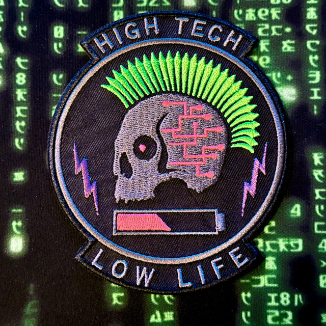 Cyberpunk skull with green mohawks. High Tech Low Life.