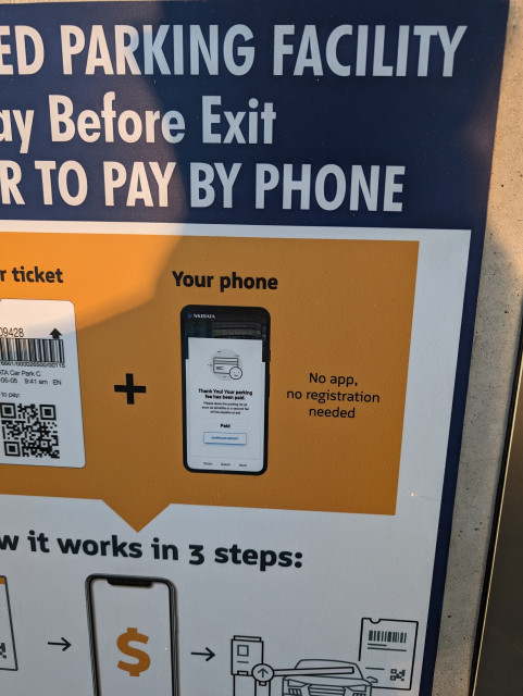 Pay by phone sign assuring readers that they need not download an app nor create an account, Avalon Express parking lot, Long Beach, California, USA
