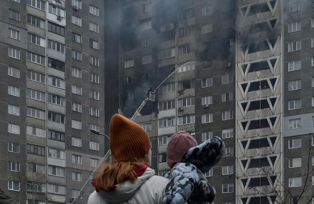 Young Kyiv mother watches her home burn after Russian air raid.