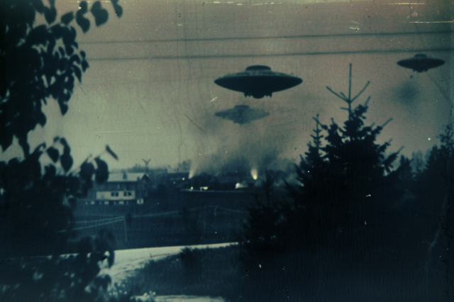 Flying saucers over a small town by a river
