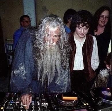Gandalf and Frodo behind a dj table 

Photoshopped from the original set 