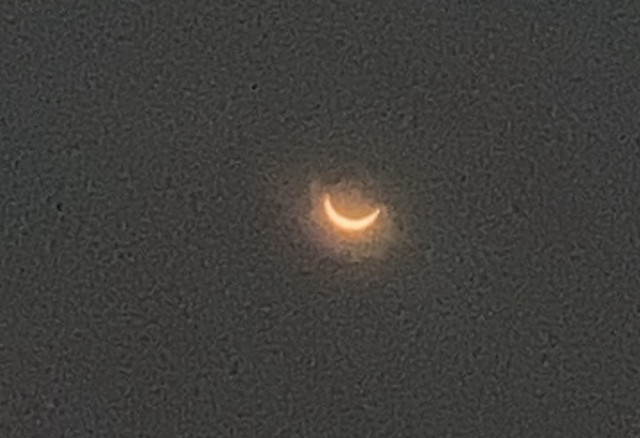 A more zoomed in version slightly later where you can really see the moon shape