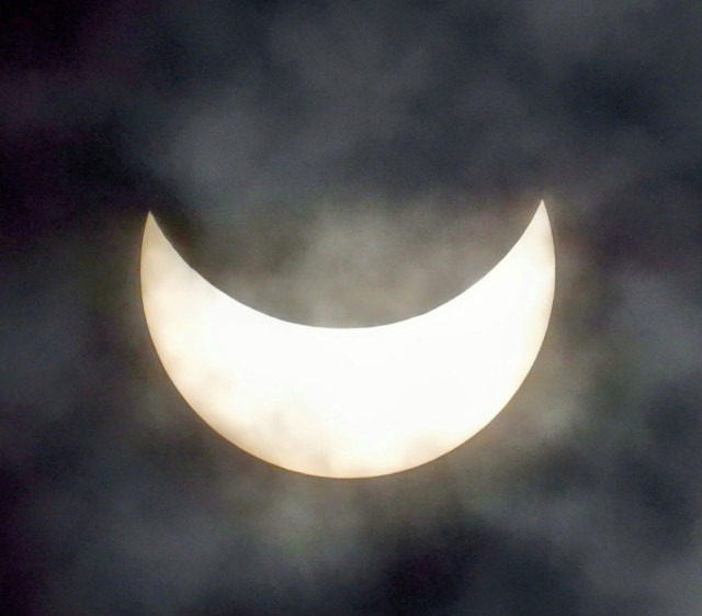 A picture of the 2024 solar eclipse. With clouds. A lot of clouds. 