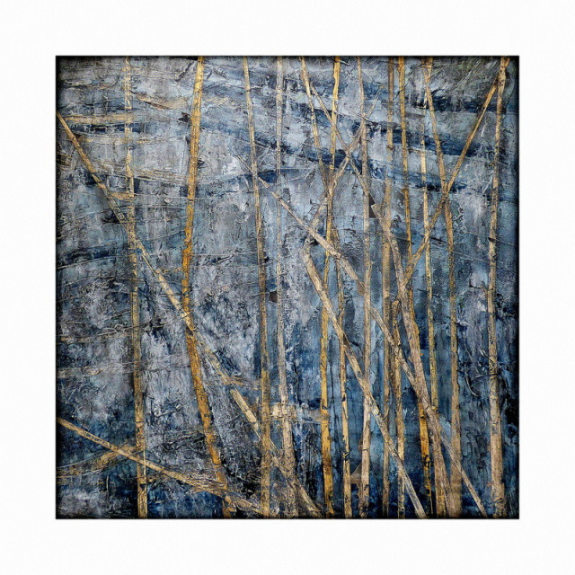 A colour photograph of a painting of reeds over deep blue water.