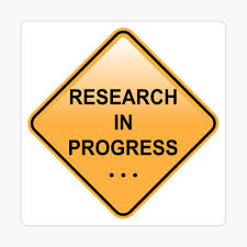 A yellow road sign written "Research In Progress"
