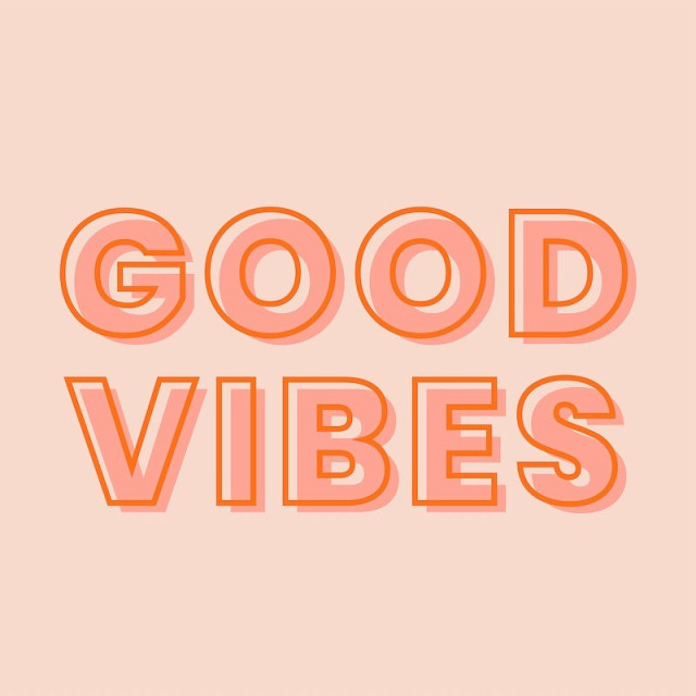 An image with a peach colored background and the words Good Vibes in an orange bubbly like font.