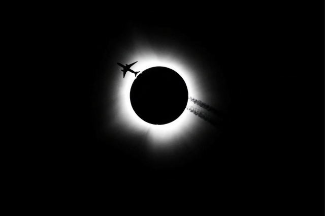 Jet passing in front of the April 8 solar eclipse. Photo by Bobby Goddin