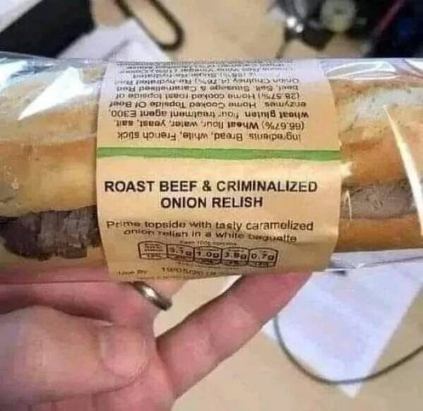 A sandwich that is wrapped up and has a label on it that says:
Roast Beef & Criminalized Onion Relish