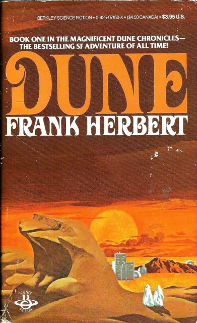 Front cover of an early edition of Dune by Frank Herbert. A desert-scape, retro oriental font.