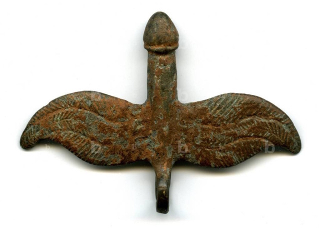 A bronze phallus thought to be from ancient Rome with wings and a loop to be worn as an amulet.