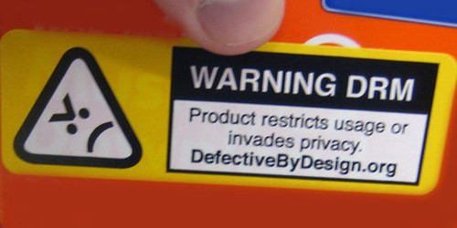 Image that says "Warning DRM | Product restricts usage of invades privacy. defectivebydesign.org"