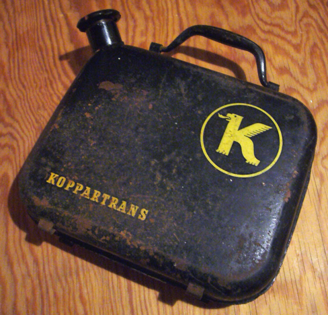 Vintage petroleum tank with “KOPPARTTRANS” written on the side and the Koppartrans logo printed on it