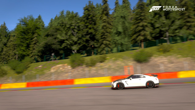 White Nissan GT-R with a matte carbon fiber hood at Spa.