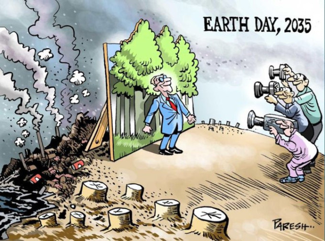 Editorial cartoon titled: Earth Day, 2035. A man in a business suit, either a politician or a corporate CEO, poses in front of a billboard showing beautiful green trees. Photographers and news media gather around to take his picture. Everyone is smiling. But behind that billboard, we see industrial smokestacks, heaps of trash, polluted waters, and the stumps of clearcut forests.
