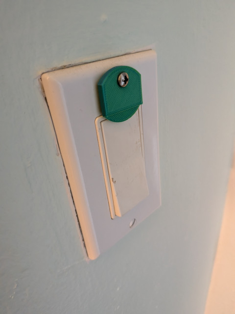 A light switch that is fixed into a single position