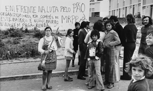 Residents on the streets of a working-class district of Lisbon after the coup that brought down the dictatorship in April 1974.