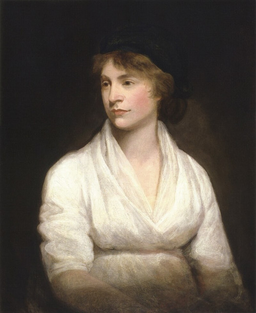 A classic oil painting depicts Mary Wollstonecraft wearing a white v-neck gown with a soft, flowing texture. The attire seems to be of a delicate fabric that drapes elegantly around the figure's arms and chest. The background is predominantly dark, contrasting with the bright white of the gown. The figure's hair appears to be styled up and away from the face, with hints of brown tones, which suggests a sense of sophistication and poise.