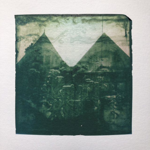 Double exposure photo : old middle-ages buildings and running water. Polaroid emulsion lift.