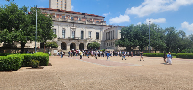 Hundreds of people gathered under the UT Austin clock tower. 