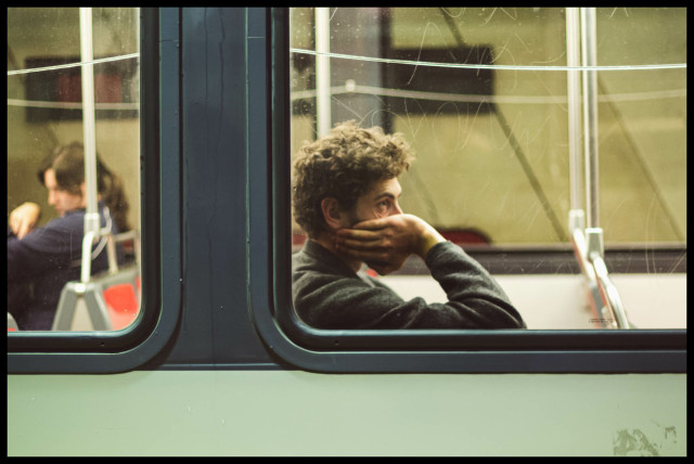 Note: The ability to see the future isn't the superpower one should wish for.

Here, in a MUNI streetcar window, a man wearily looks off into the distance. One hand holds his head as if the weight is too much for his neck.

He has seen enough.