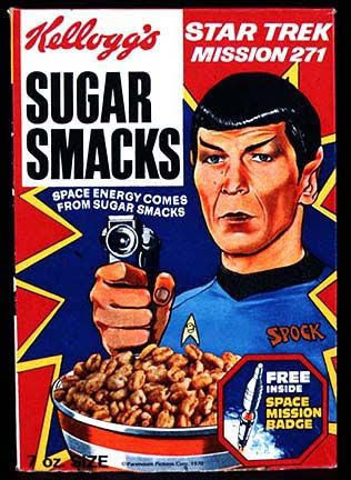 It's a cereal box for "Sugar Smacks" made by Kelloggs. Pretty good stuff but gets soggy way to fast so what I do is add a little bit of cereal to milk, eat that, and then add more cereal, but not all at once or only the first 10 or so bites are any good. Ok so Spock is in cartoon form pictured holding a phaser over a bowl of cereal, phaser aimed at us, the cereal eaters. His blue uniform, in addition to the delta shield, also has his name sewn in like he's a mechanic or something. Above his head is written "Star Trek Mission 271." Under the Sugar Smacks logo is written "Space Energy Comes From Sugar Smacks." And finally a lil' carve out pic is shown next to the bowl of sugar smacks with a space rocket taking off and the words "Free Inside Space Mission Badge." Ok I think that's all, good talk everyone. 