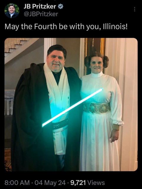 Screen shot of a tweet from Illinois governor JB Pritzker (@JBPritzker) showing him and his wife dressed as a Jedi holding a lightsaber and Princess Leia, respectively, with the text "May the Fourth be with you, Illinois!"