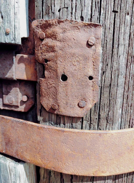 photo of rusted parts of an old wooden door