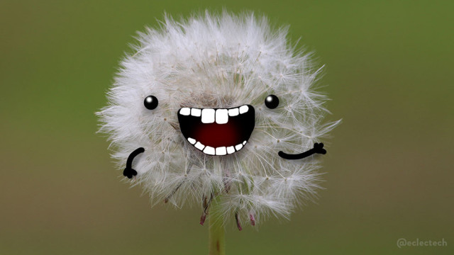 A close up photograph of a the seed head of a dandelion; a big ball of white fluff on a barely visible stalk (green against a soft focus green backdrop). I have drawn eyes, a very big smiling toothy mouth and arms, one of which is waving at you. 