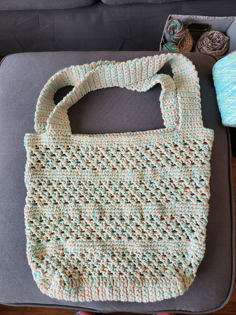 This is the finished shopping bag. It is made of recycled cotton of aqua and peach colours.