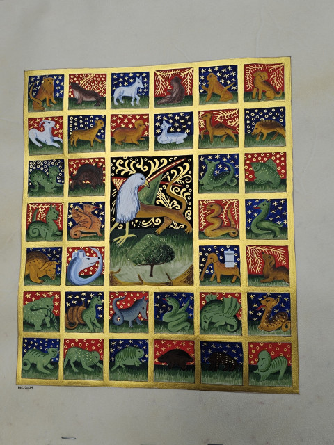 Full view of the illuminated bestiary. It is made of blue and red vignettes contained in a golden grid. Each vignette shows a fantastic beast.