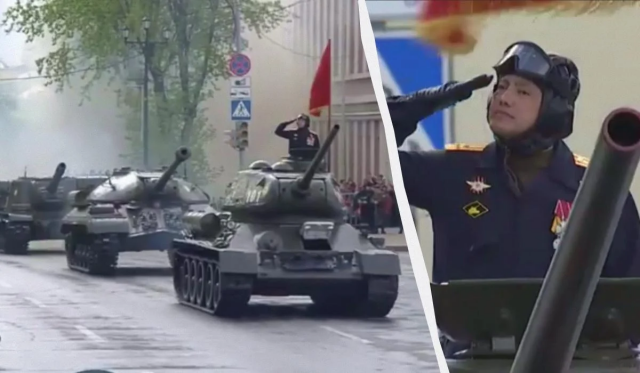 Omurbekov saluting on a tank in the parade