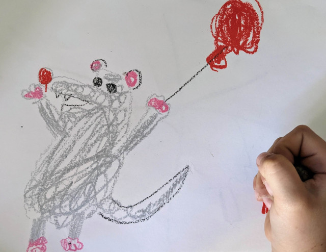 A cheerful possum with a red balloon, painted by my 5-year-old daughter. Her fist can be seen on the right of the picture