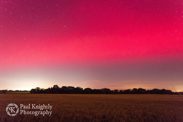 View looking south towards the edge of the aurora, over a wheat field in southeast Kansas.