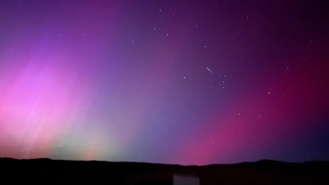 Aurora Australis Central Otago - a deep purple sky with soft shifts of green, pink, mauve, blue
