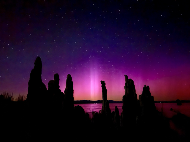 Pink and purple aurora with pillars over Mono Lake tufa. 