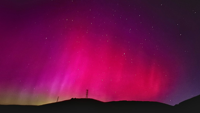 Rainbow hues from the Northern Lights stripped sky in Northern California