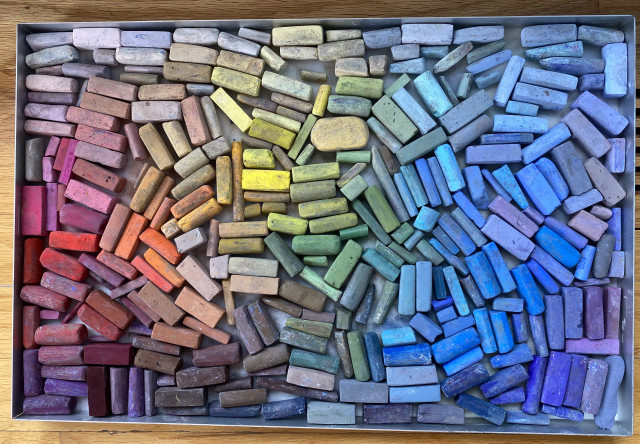 My pastel box from a year ago. Sticks are arranged in spectrum. Lots of blues.