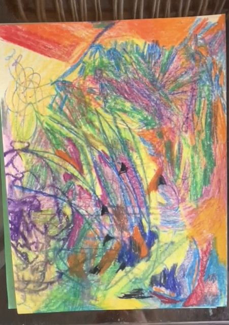 A paper covered in colorful crayon scribbles in an "abstract expressionist" style. 