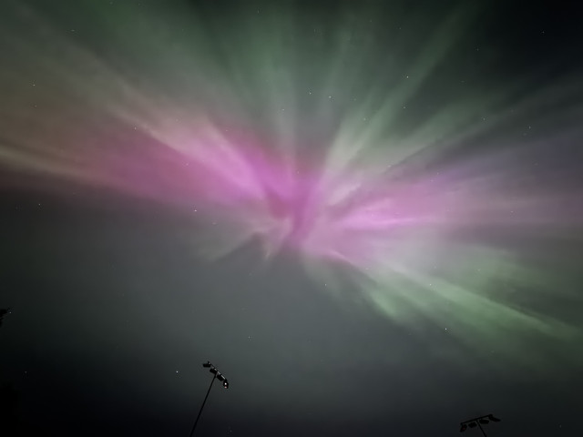 Red & green Aurora directly overhead. Stars can be seen as well. 