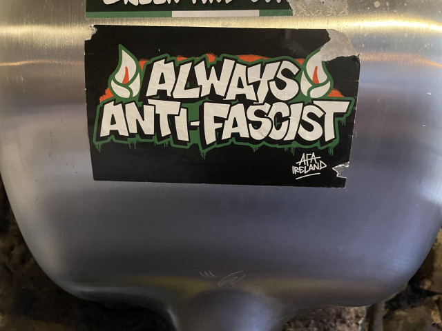 A sticker on a hand dryer that reads “Always anti-fascist – AFA Ireland”