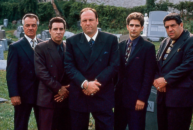 The Sopranos crew, all wearing smart suits.