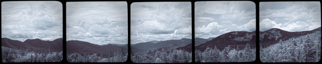 Panoramic view of forested mountains under a cloudy sky, presented across five vertically-framed square sections. They are monochrome but toned to give a hint of color. It is presented as if it is five photos placed side by side. I’m perfectly capable of stitching them into a proper panorama, but the scene is kind of boring so I resorted to tricks for a bit more visual interest.