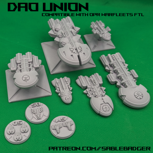 A picture of some small 3d printed rounded style spaceships in Gray PLA plastic.