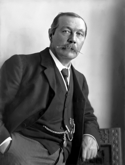 Arthur Conan Doyle by Walter Benington.

Retro black and white photo featuring a man sporting a mustache.