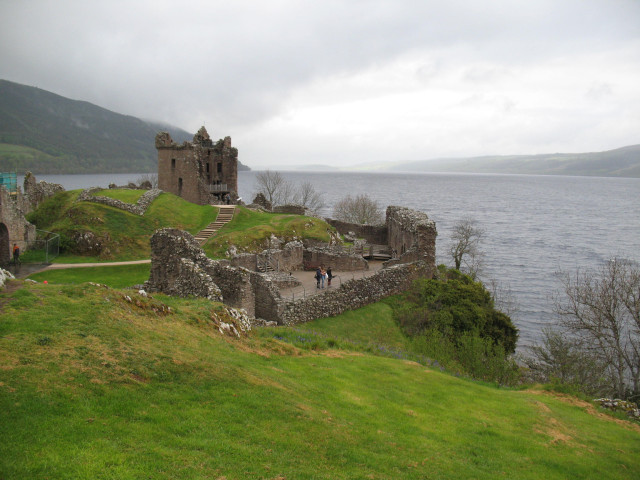 Urquhart Castle at Loch Ness, Scotland. Ruines of the castle overviewing Loch Ness, sky gray and cloudy.