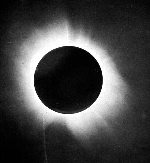 One of Eddington's photographs of the total solar eclipse of 29 May 1919, presented in his 1920 paper announcing its success, confirming Einstein's theory that light "bends".

Frank Watson Dyson / Arthur Eddington / Charles Rundle Davidson - F. W. Dyson, A. S. Eddington, and C. Davidson (1920). "A Determination of the Deflection of Light by the Sun's Gravitational Field, from Observations Made at the Total Eclipse of May 29, 1919". Philosophical Transactions of the Royal Society A: 332. ISSN 1364-503X.

From the report of Sir Arthur Eddington on the expedition to verify Albert Einstein's prediction of the bending of light around the sun. In Plate 1 is given a half-tone reproduction of one of the negatives taken with the 4-inch lens at Sobral. This shows the position of the stars, and, as far as possible in a reproduction of this kind, the character of the images, as there has been no retouching. A number of photographic prints have been made and applications for these from astronomers, who wish to assure themselves of the quality of the photographs, will be considered as as far as possible acceded to.