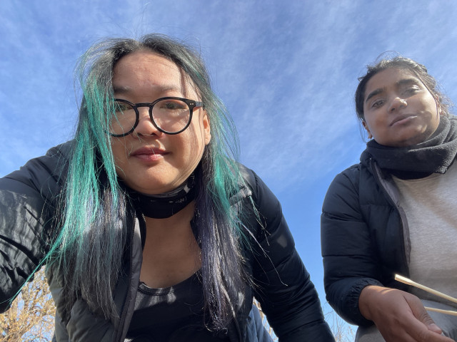 Me in a selfie. My friend next to me. Blue skies behind. 